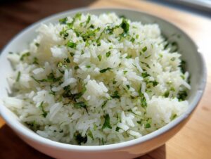Close-up of fluffy white cilantro lime rice topped generously with chopped fresh cilantro.